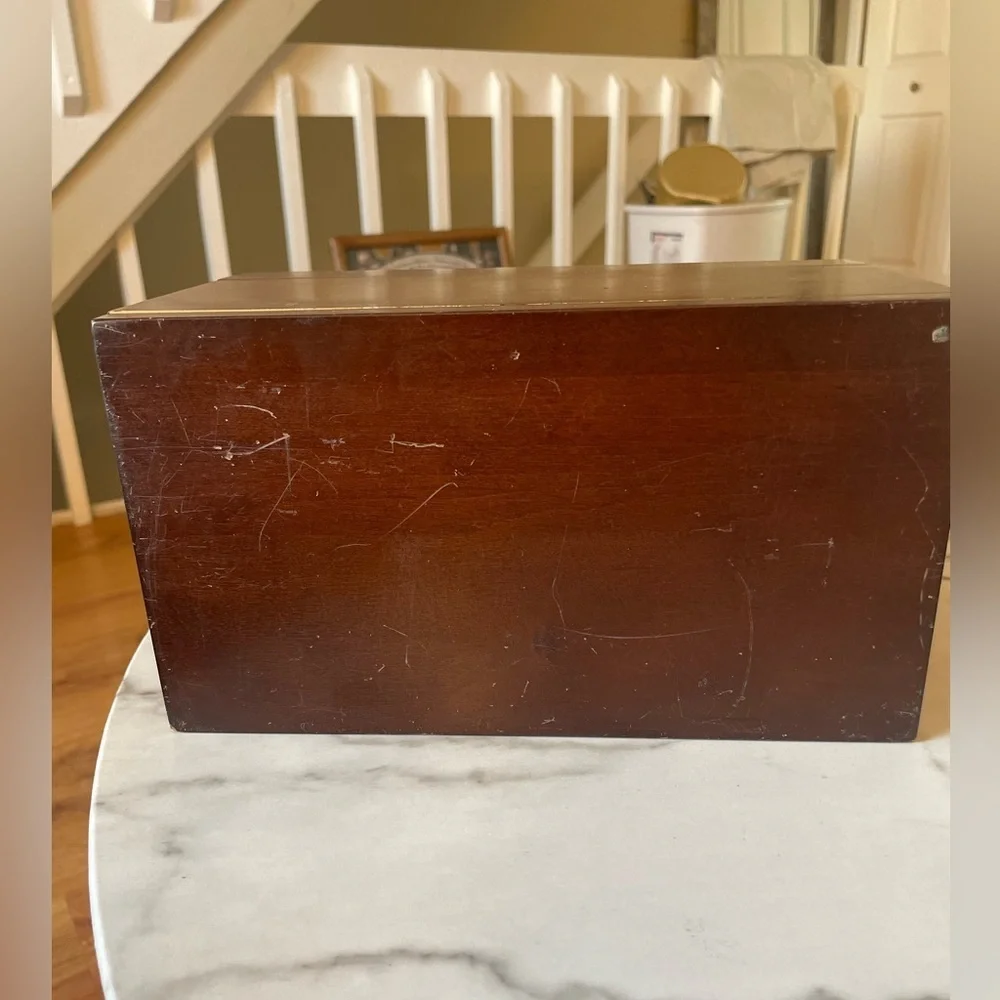 Wooden box for displaying coins with the name marked Danze logo